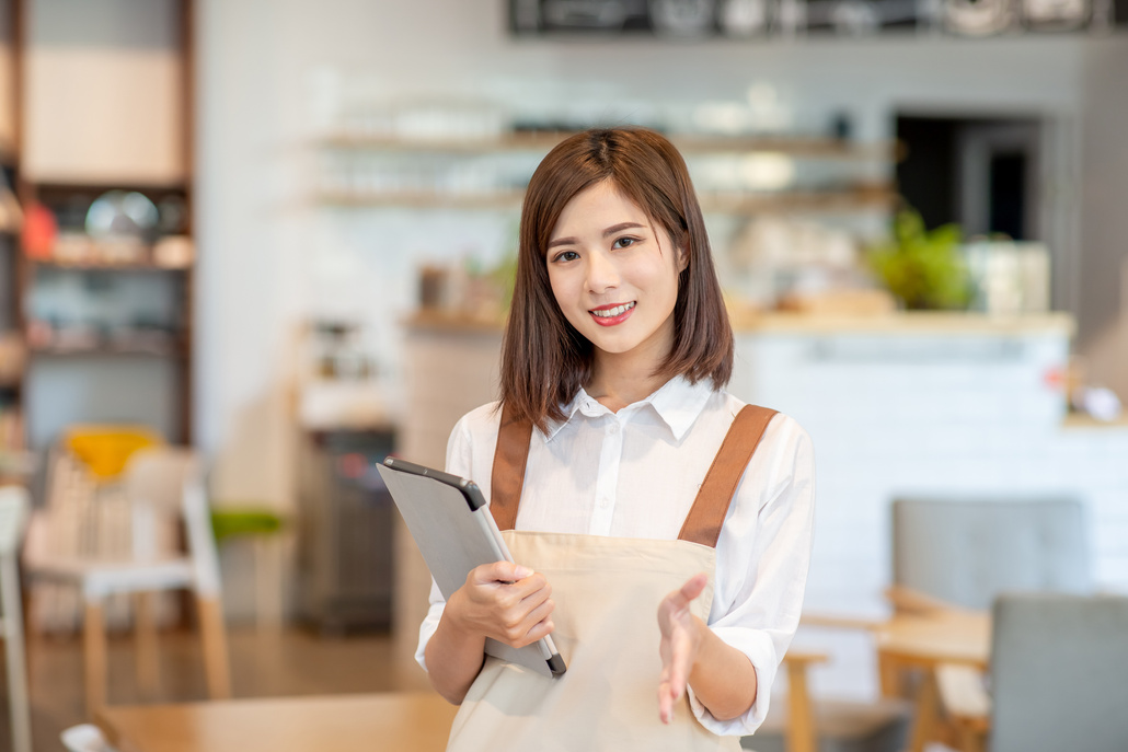 Young Asian Shopkeeper Smile